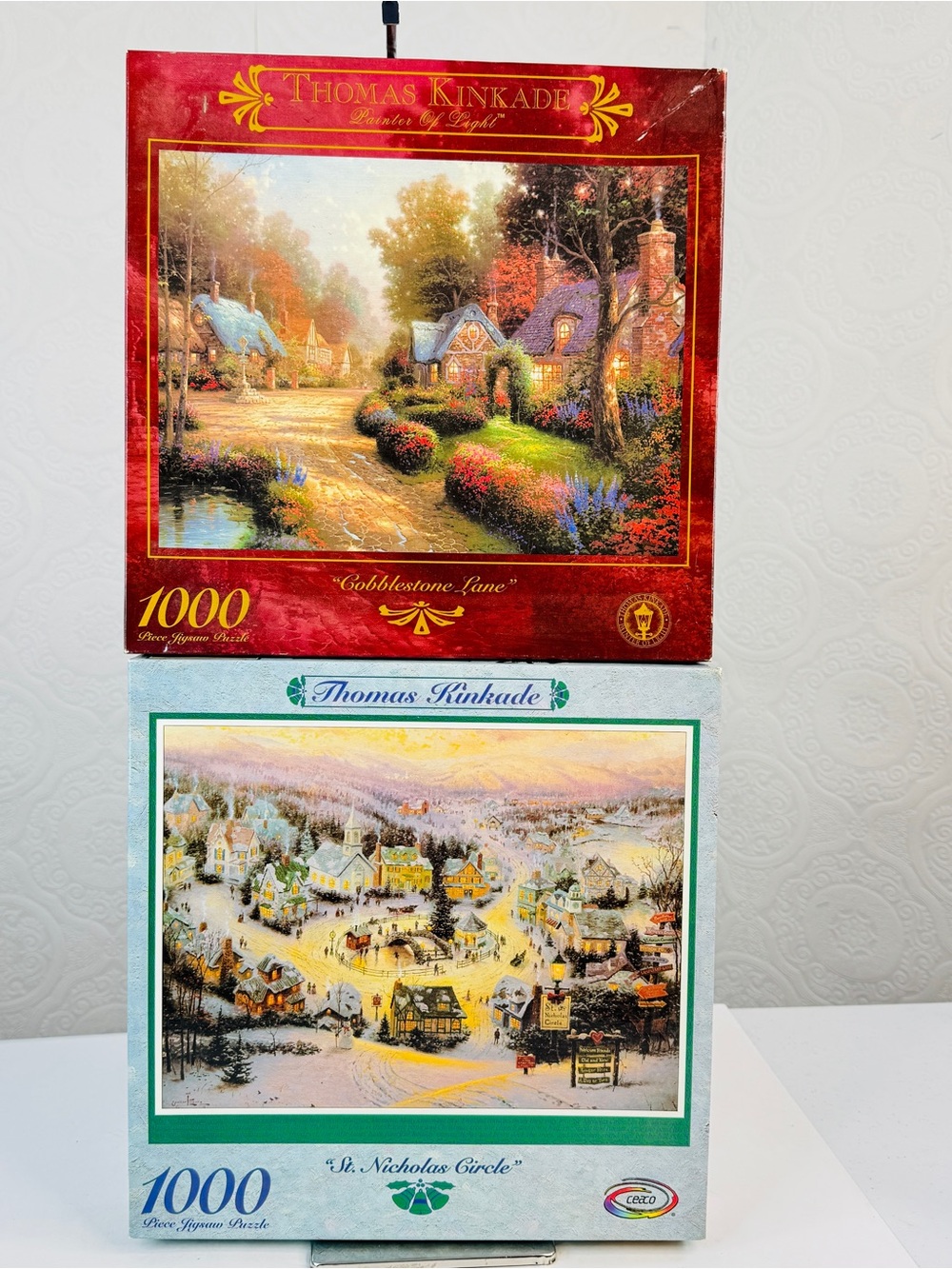 Thomas Kinkade 1000p Puzzles St. Nicholas Circle & Cobblestone Lane Set of 2 New